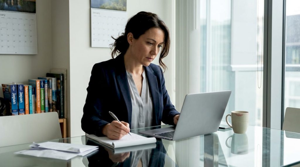 Woman reviewing offshore banking documents at home
