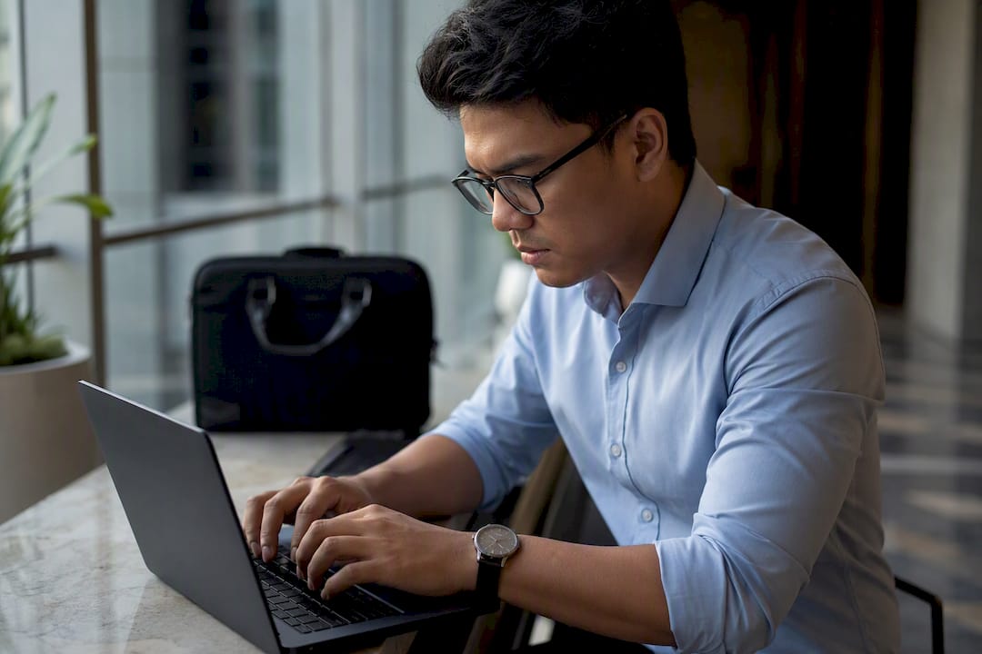Hands retrieving UETR code on keyboard